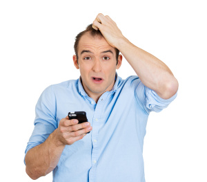 Surprised confused, man with phone scratching head